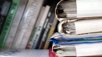 Aged Office Documents in Stacked Worn Binders on Shelf image