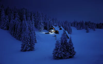 Cozy Alpine Cabin in Snowy Winter Forest at Twilight image