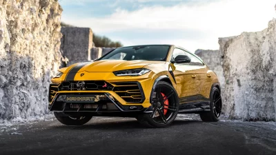Yellow Manhart Lamborghini Urus Performance SUV on Industrial Background image
