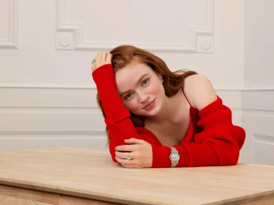 Engaging Portrait of Red-Haired Woman with Freckles and Elegant Jewelry image