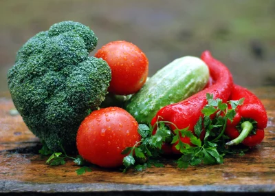 Vibrant Harvest of Washed Fresh Vegetables: Broccoli, Tomatoes, Cucumber, Red Peppers with Parsley image