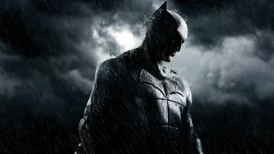 Dramatic Batman Portrait in Rain: Brooding Dark Knight Under Stormy Sky image