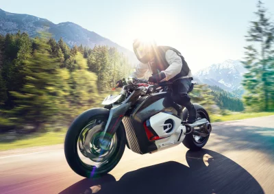 Dynamic Futuristic Motorcycle Ride with Sun Flare on Winding Mountain Road image
