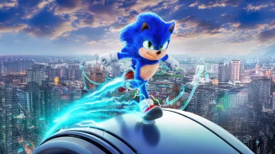 Dynamic Sonic the Hedgehog Sprinting Over Metropolis Skyline with Electric Aura image