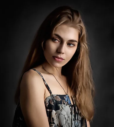 Contemplative Young Woman with Long Blonde Hair in Patterned Dress image