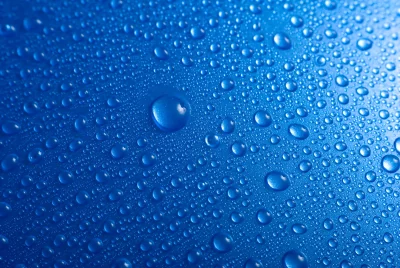Water Droplets on Vibrant Blue Hydrophobic Surface image