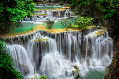 Multi-Tiered Waterfall Cascading into Emerald Green Pools image