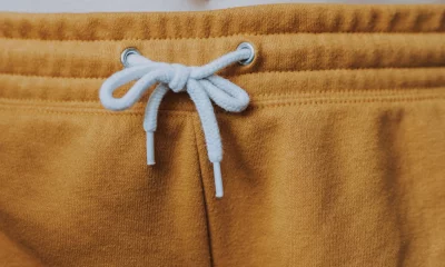 a mustard yellow drawstring waistband with a white drawstring