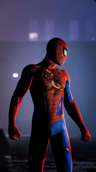 Spider-Man in a Battle-Damaged Suit Standing in a Gritty City image