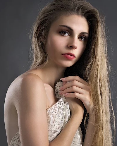 Serene Portrait of Young Woman with Blonde Hair and Direct Gaze image