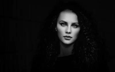 Intense Black and White Portrait of Woman with Piercing Green Eyes image