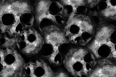 Pile of Human Skulls in Monochrome: Dark, Grungy, and Ominous Horror Background image
