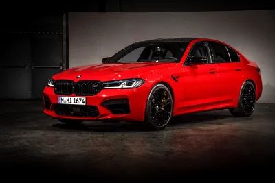Red BMW M5 Performance Sedan with Black Wheels Studio Showcase image