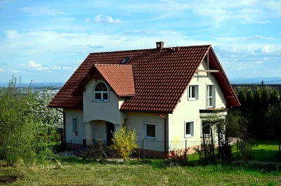 Residential House with Terracotta Roof and Scenic Countryside View image