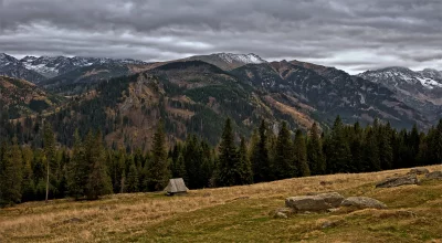 Misty Autumn Mountain Landscape with Traditional Wooden Hut image