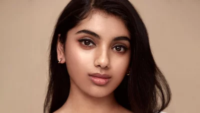 Close-up Portrait of Serene Young Woman with Dark Hair and Natural Makeup image