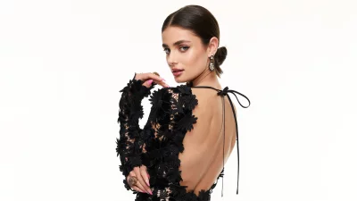 Elegant Woman Posing Confidently in Backless Black Lace Dress image