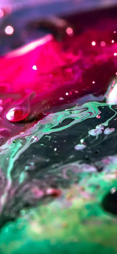 Abstract Macro of Vibrant Pink and Green Liquid Swirls with Glittering Particles image
