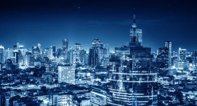 Vibrant Blue Illuminated City Skyline Night Urban Landscape image