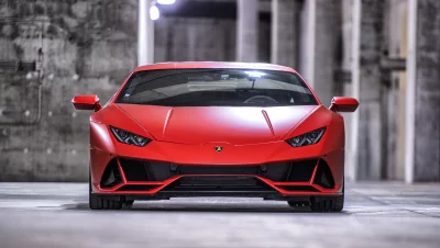 Striking Red Lamborghini Huracán Sports Car in Modern Concrete Garage image
