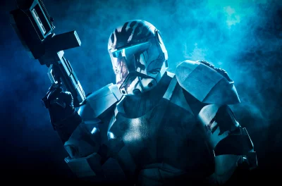 Intense Futuristic Armored Warrior with Blaster Rifle in Blue Haze and Dark Atmosphere image