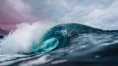 Powerful Ocean Wave Curling with Luminous Blue-Green Barrel image