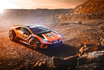 Dynamic Orange Lamborghini Huracán Sterrato Off-Road Supercar in Rocky Desert Landscape at Sunset image