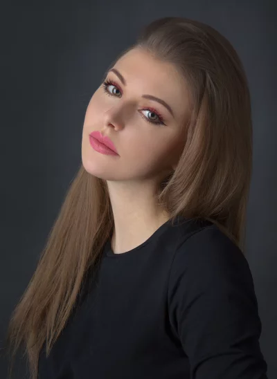 Captivating Woman Portrait with Striking Pink Makeup and Long Hair image