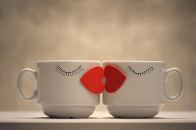 Romantic Mugs Kissing with Red Hearts Valentine's Day Concept image