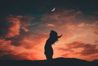 Serene Woman Embracing Freedom Under Twilight Sky with Crescent Moon and Flying Birds image