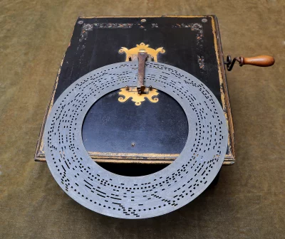 Antique Mechanical Music Box with Perforated Metal Disc Record image