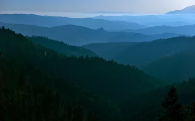 Layered Blue Mountain Landscape with Hazy Forest Ridges image