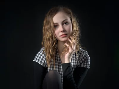 Studio Portrait of Young Woman with Wavy Hair in Plaid image