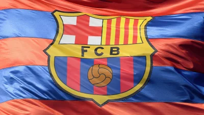 Waving FC Barcelona Football Club Flag with Official Emblem and Vibrant Colors image