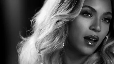 Iconic Beyoncé Portrait: Captivating Black and White Beauty with Luxurious Wavy Hair image