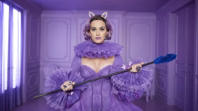 Glamorous Pop Star in Ornate Purple Gown, Whimsical Cat Ears, and Embellished Scepter image