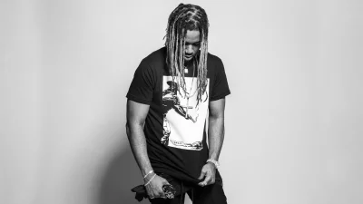 Stylish Man with Dreadlocks in Black and White Studio Portrait image