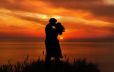 Romantic Couple Silhouette Kissing Fiery Ocean Sunset Embrace image