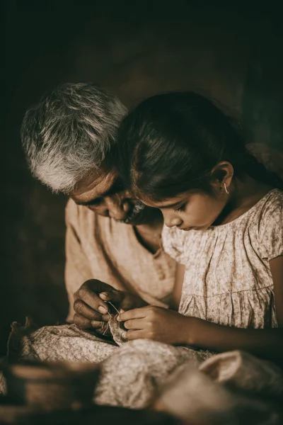 Grandparent Teaching Grandchild Traditional Craft: Hands-On Learning and Intergenerational Bonding image