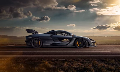 Sleek Dark Gray Hypercar Parked on Runway with Golden Sunset Sky image