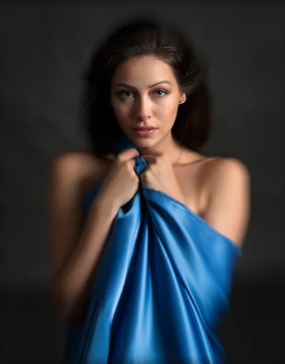 Elegant Woman with Blue Silk Draping, Dynamic Studio Portrait image