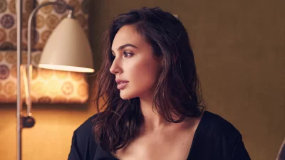 Elegant Woman's Profile Portrait with Dark Wavy Hair in Soft Ambient Light image