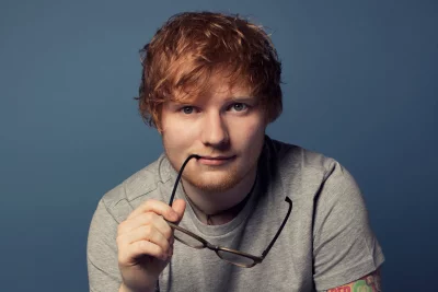 Thoughtful Portrait of Ed Sheeran, the Musician, with Red Hair and Glasses image