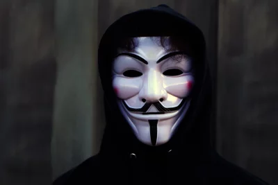 Anonymous Mask in Dark Hoodie: Cinematic Vigilante Wallpaper HD image