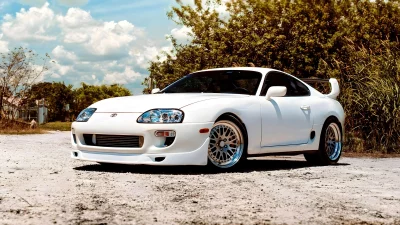 Iconic White Toyota Supra MK4 Japanese Sports Car Parked on Sunny Dirt Road image
