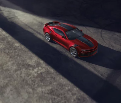 Powerful Red Sports Car Cruising Dynamic Asphalt Cinematic Wallpaper Design image