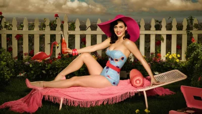 Katy Perry Lounging in Vibrant Retro Summer Garden with Pink Hat and Refreshing Drink image