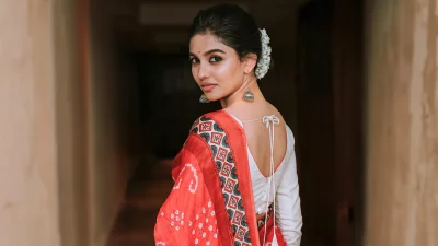 Young Indian Woman Posing in Traditional Saree with Floral Hair image