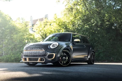 Sleek Matte Black Mini Cooper JCW GP with Gold Accents on Asphalt image