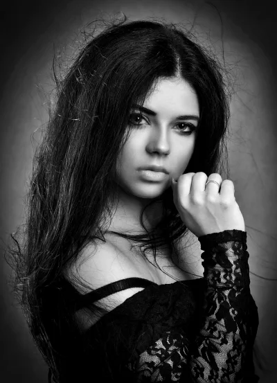 Dramatic Monochrome Portrait of a Pensive Woman with Long Hair and Elegant Lace image